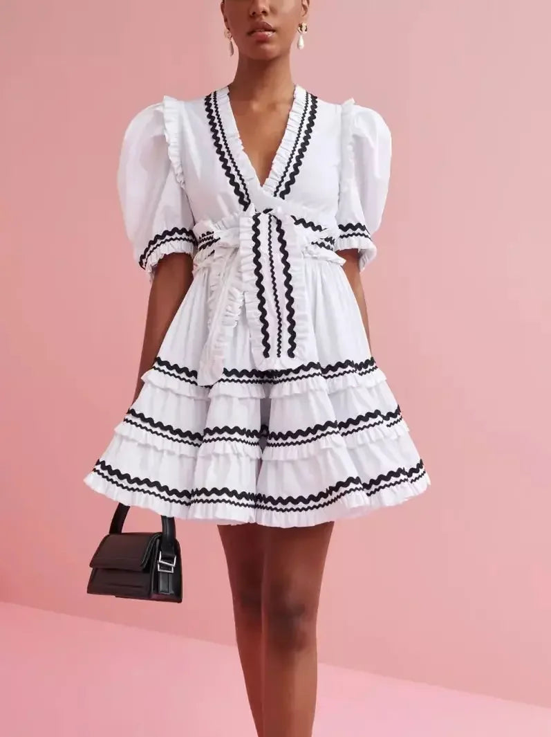 elegant and sophisticated Mimi dresses for a night out on the town.Belted V-Neck A-Line Mini Dress in White and Black